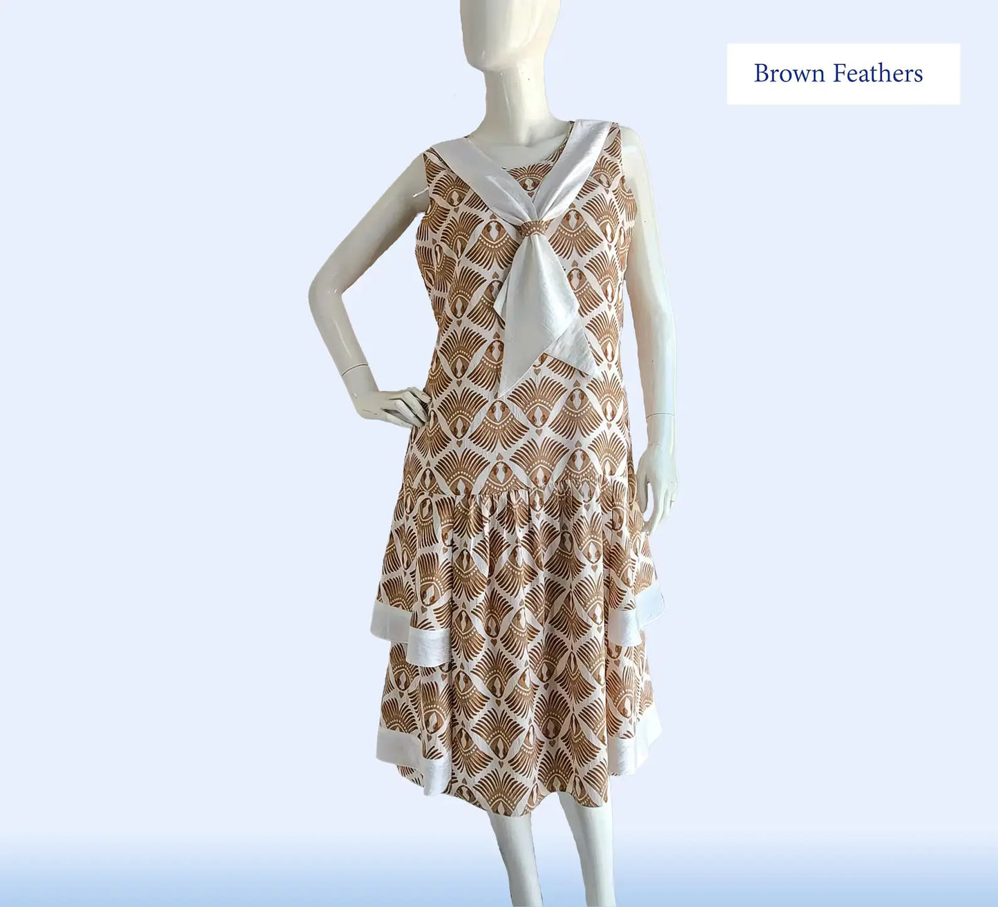 Sleeveless 1920s daywear in feather deco print and tiered skirt - a 920s art deco dress